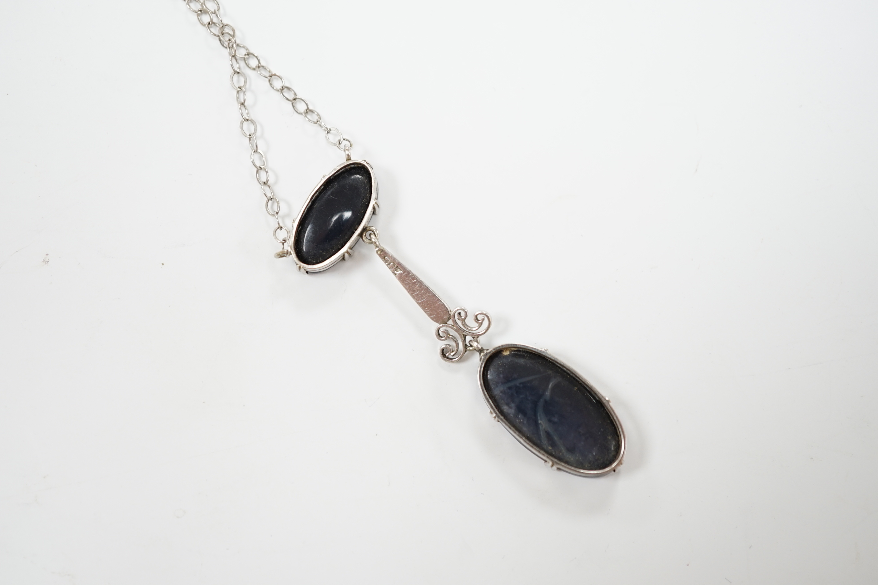 A 1920's style 9ct white metal and two stone black opal doublet set drop pendant necklace, overall 58cm, gross weight 4 grams.
